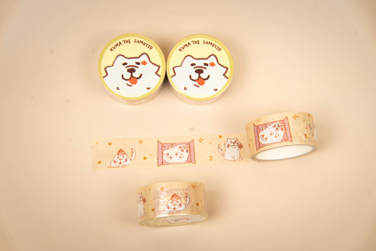 Two rolls of tape with dog faces